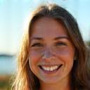 Emily T. from UK smiling on a sunny day